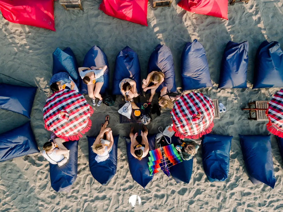 Students gathered at a beach lounge